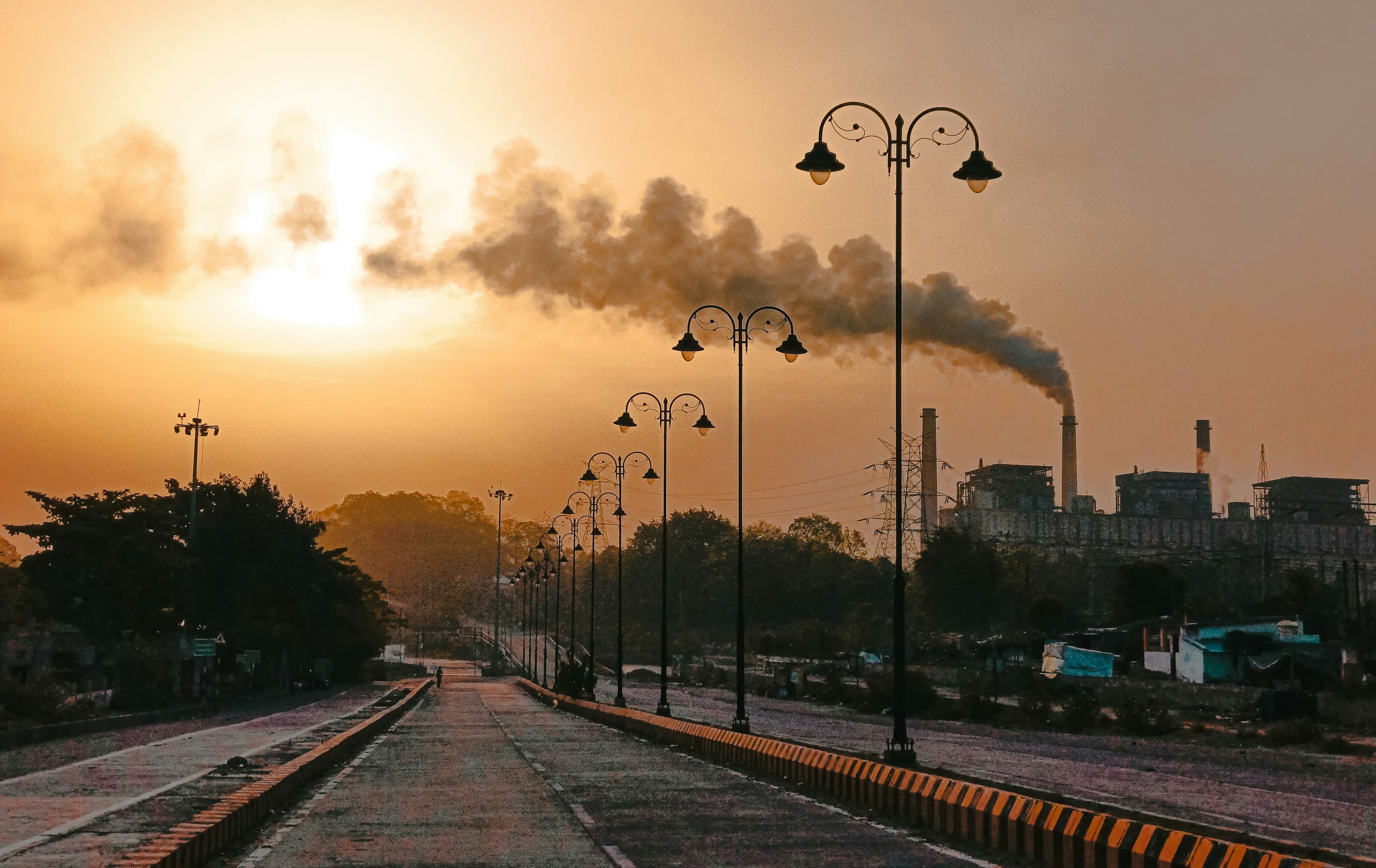 Inverse modelling approach to assess air pollutant emission trends, and source contributions in highly polluted cities